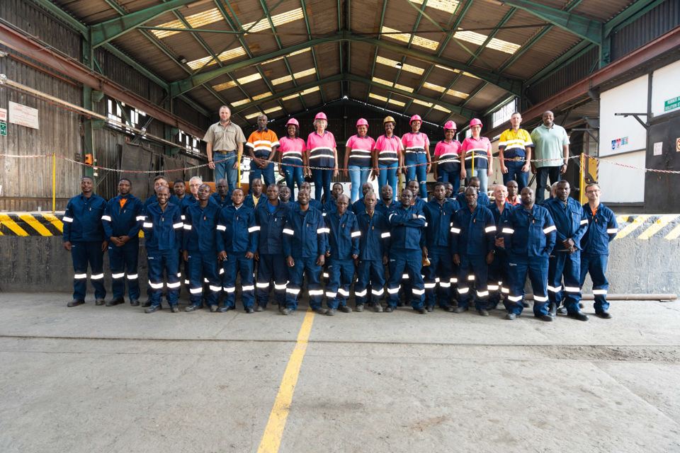 The full Bronzeback team standing in the workshop