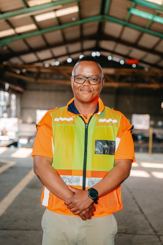 Portrait of a Bronzeback team member in a high-visibility vest