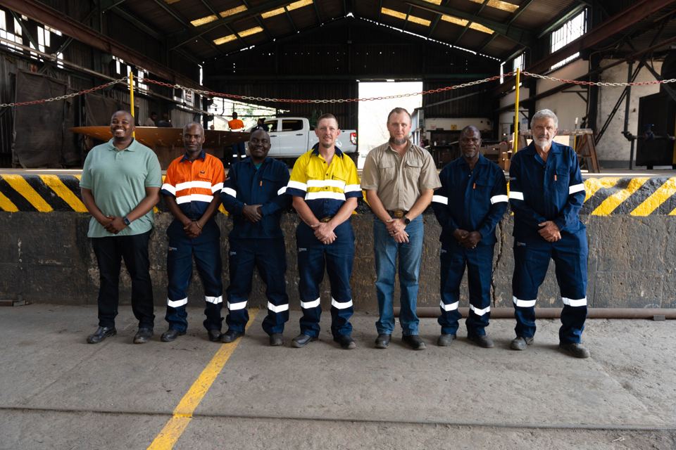 The site team standing in a row